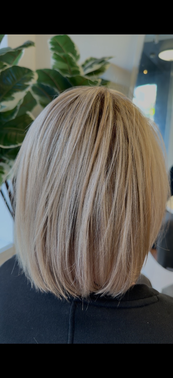 Polished blonde bob with dimensional highlights